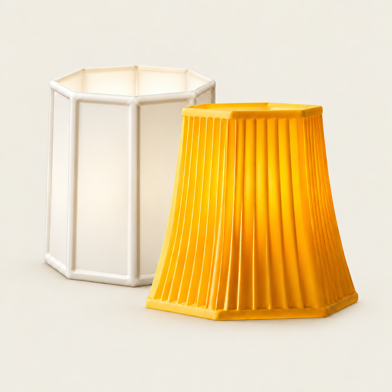 Two sculptural lampshades in porcelain white and golden yellow